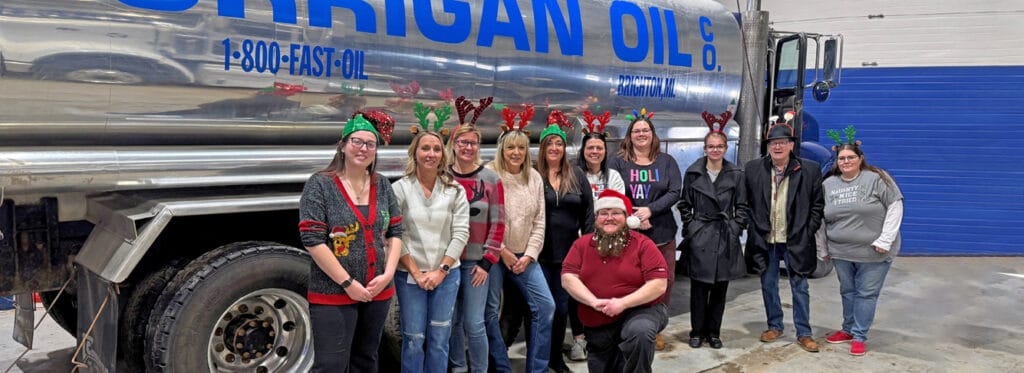 Corrigan oil employees in front of a corrigan truck