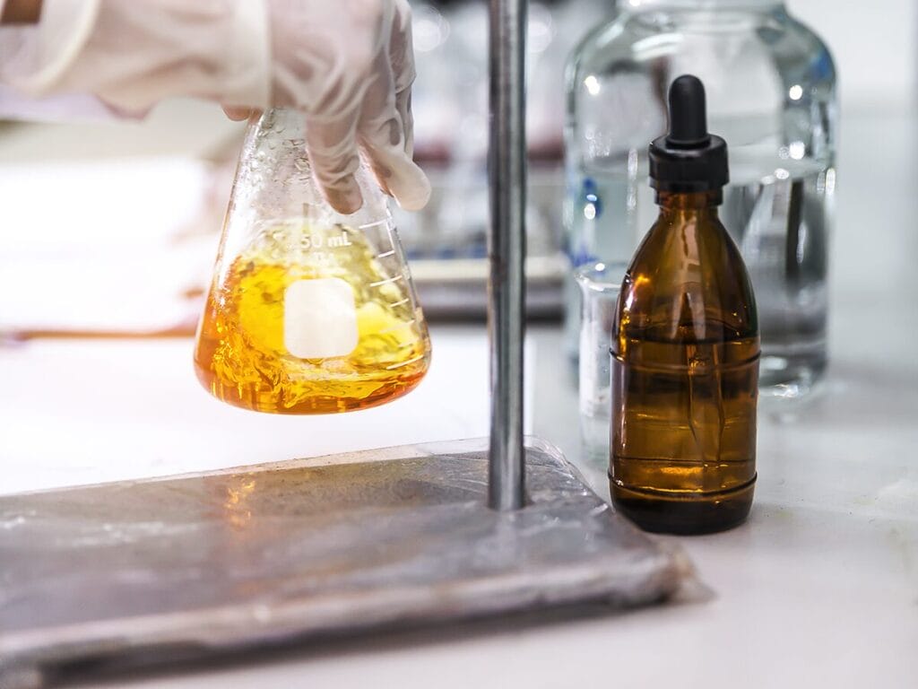 flask in a lab with lubricants