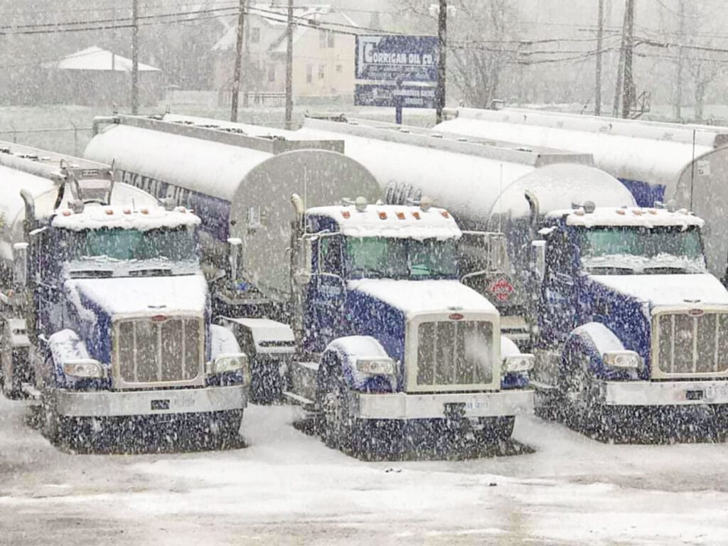 corrigan oil trucks during a snow storm